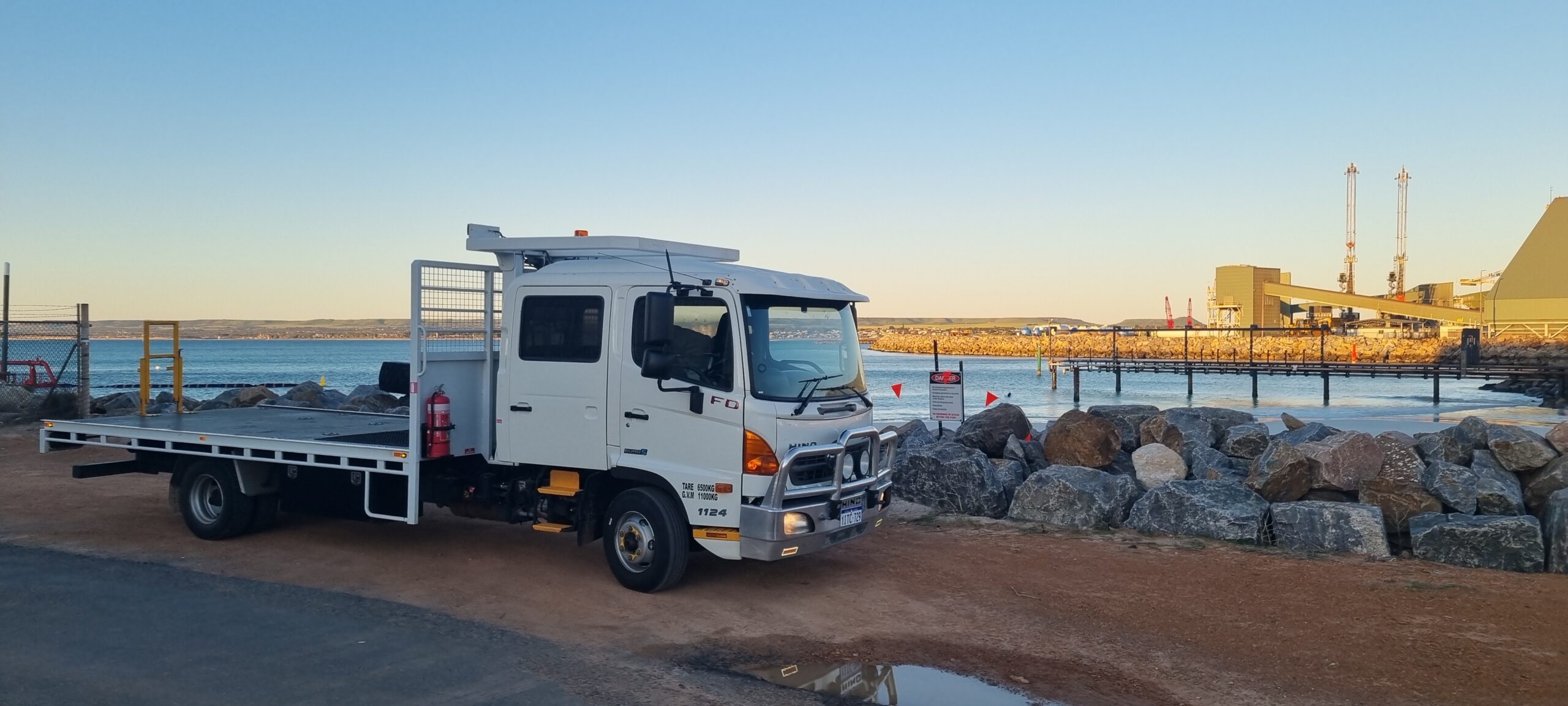 Hino 500 FD1124 hotshot truck delivering urgent freight to Dampier WA